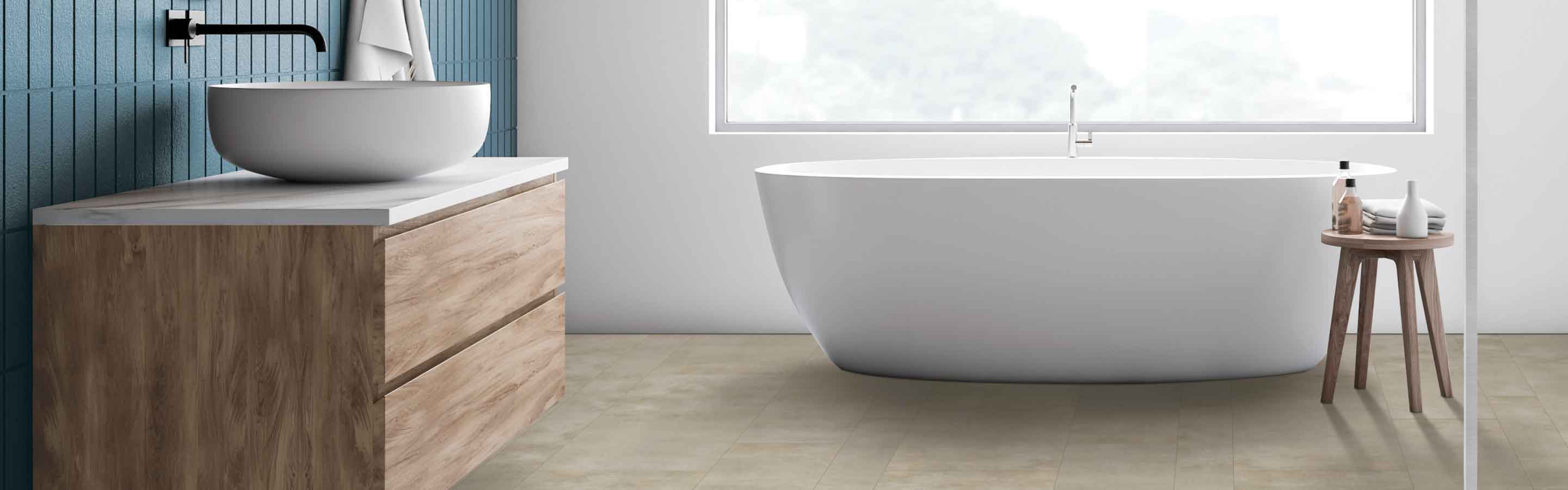 bathroom with deep soak tub and blue accent wall, stone-look vinyl flooring