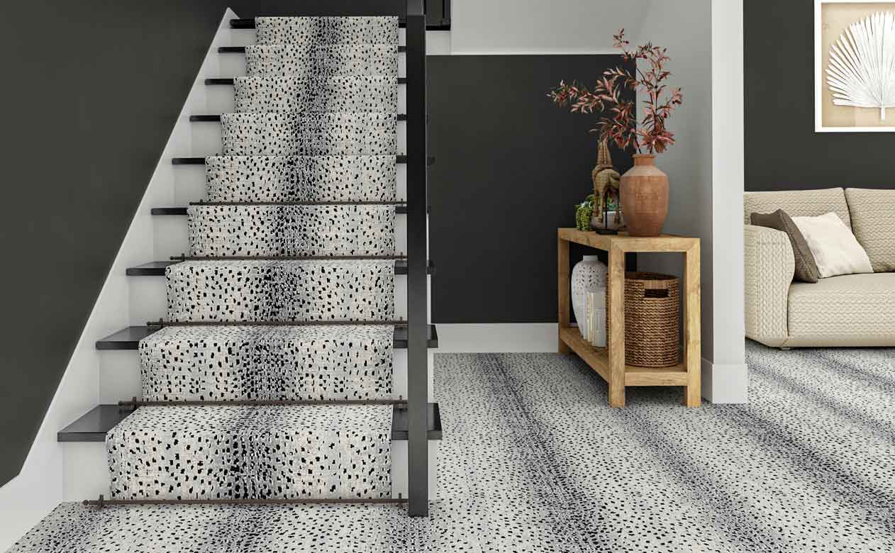 gray spotted carpet on staircase in modern foyer